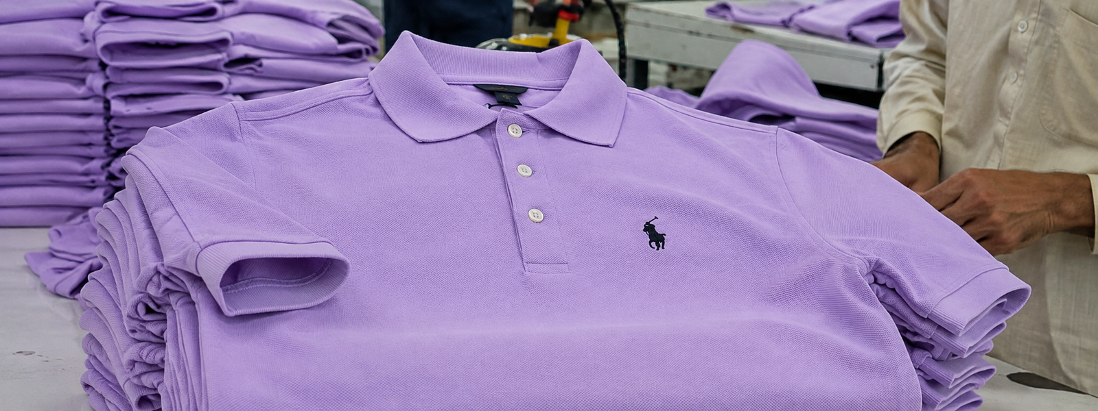 Embroidery machine stitching a logo